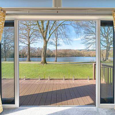 Willerby Vogue Nouveau for sale on lake edge pitch at 5 star caravan holiday park. Pitch view photo