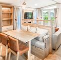 Regal Autograph caravan holiday home for Sale lake edge at Discover Parks - kitchen dining area  photo