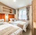 Regal Autograph caravan holiday home for Sale lake edge at Discover Parks - second bedroom  photo