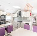 Atlas Ovation Lodge caravan holiday home for sale on 5 star caravan park with fishing - kitchen dining area photo