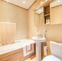 Pemberton Serena caravan holiday home for sale on 5 star caravan park. Main bathroom photo