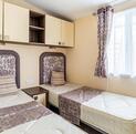 Regal Symphony holiday home for sale at Arrow Bank Country Holiday Park - twin bedroom photo