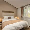 Luxury self-catering holiday lodge at Arrow Bank - main bedroom photo